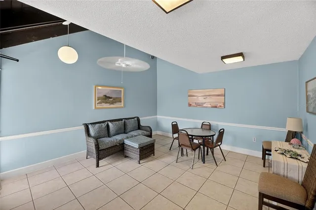 an aerial view of residential houses with outdoor space and street view