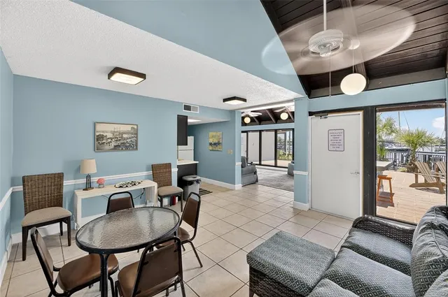 an aerial view of a city with lots of residential buildings ocean and mountain view in back