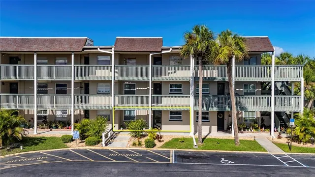 a view of a livingroom with furniture window and wooden floor