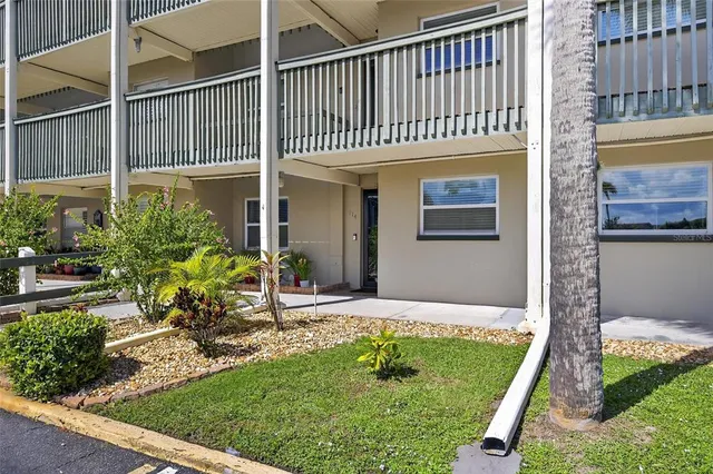 a living room with furniture and a ceiling fan