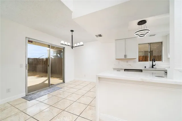 a spacious bathroom with a shower sink and mirror