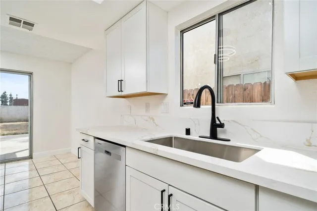 a kitchen with a sink and a window