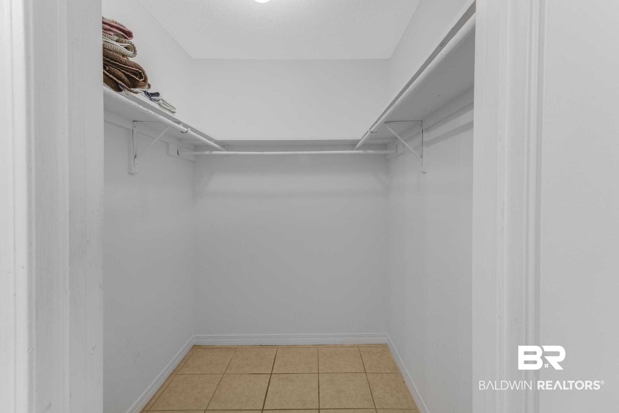 110 5th Street, Unit A 103 Daphne, AL 36526 - Photo 17 of 28 Walk in closet with light tile patterned floors