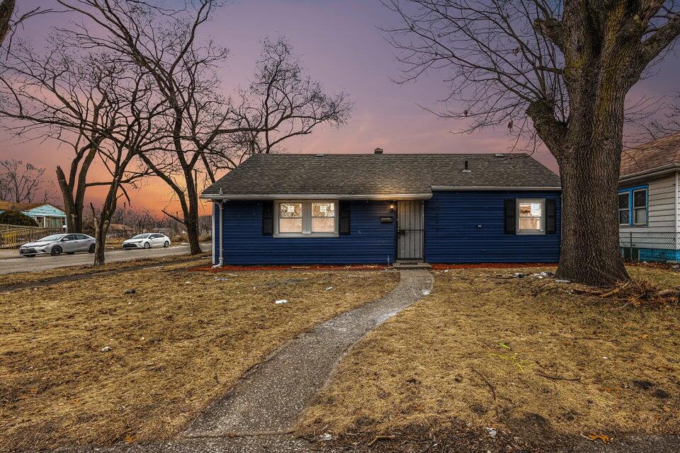 5207 West 4th Place Gary, IN 46406 - Photo 1 of 15 a house with trees in front of it