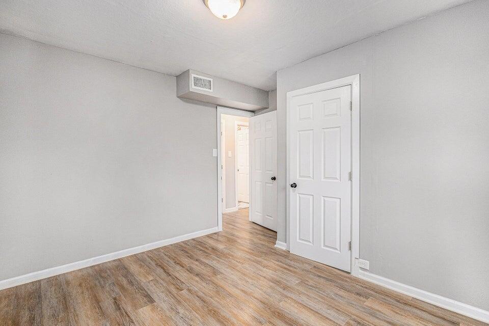 5207 West 4th Place Gary, IN 46406 - Photo 11 of 15 a view of a hallway with wooden floor