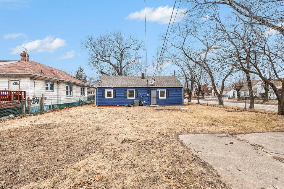 5207 West 4th Place Gary, IN 46406 - Photo 15 of 15 a front view of a house with a yard covered in snow