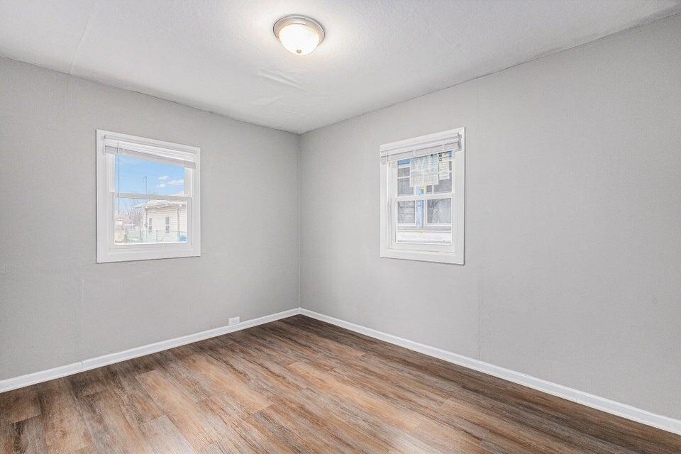 5207 West 4th Place Gary, IN 46406 - Photo 7 of 15 a view of empty room with wooden floor