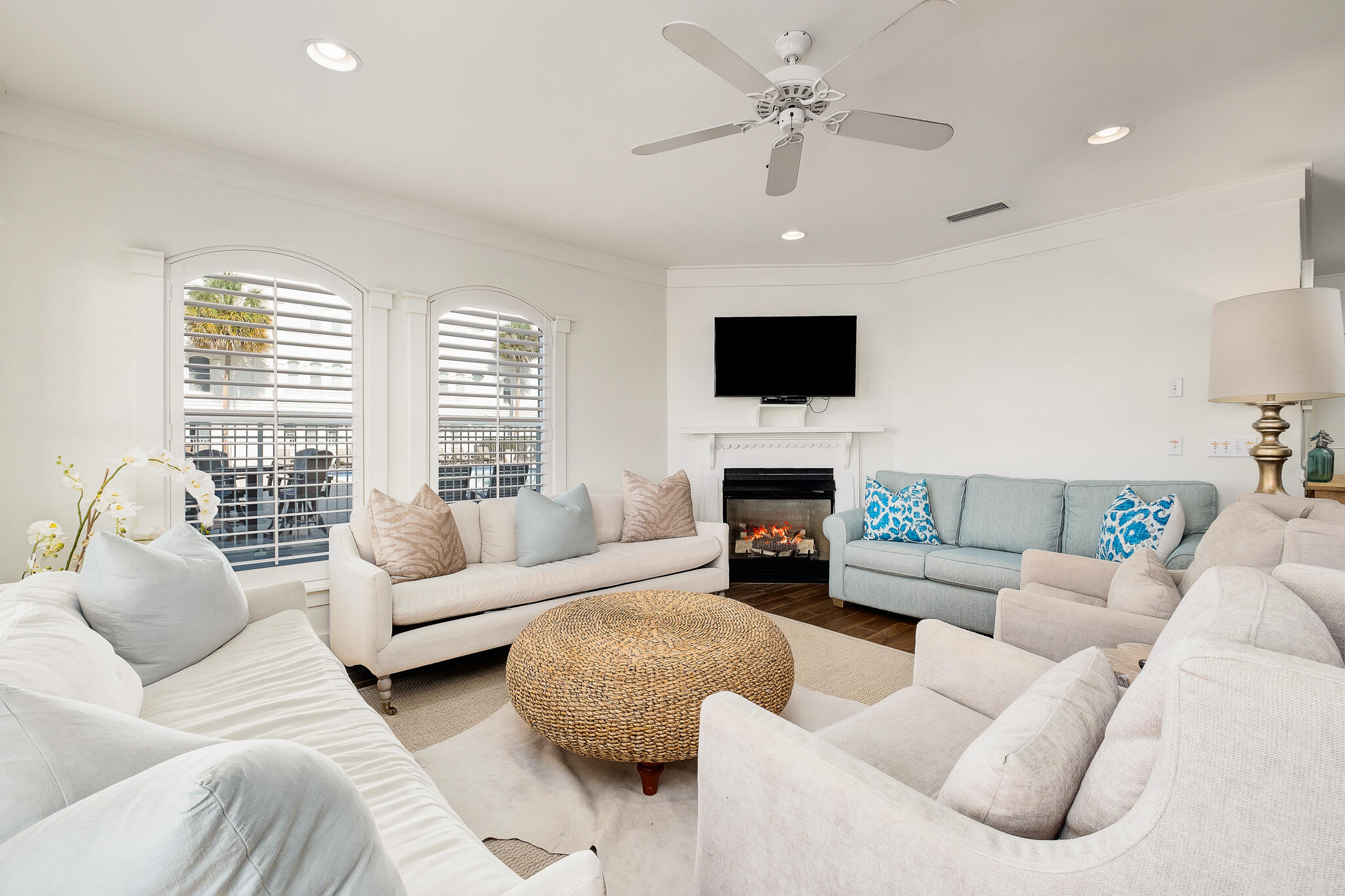 10140 East County Highway 30A, Unit A102 Inlet Beach, FL 32461 - Photo 14 of 37 a living room with furniture a fireplace and a flat screen tv
