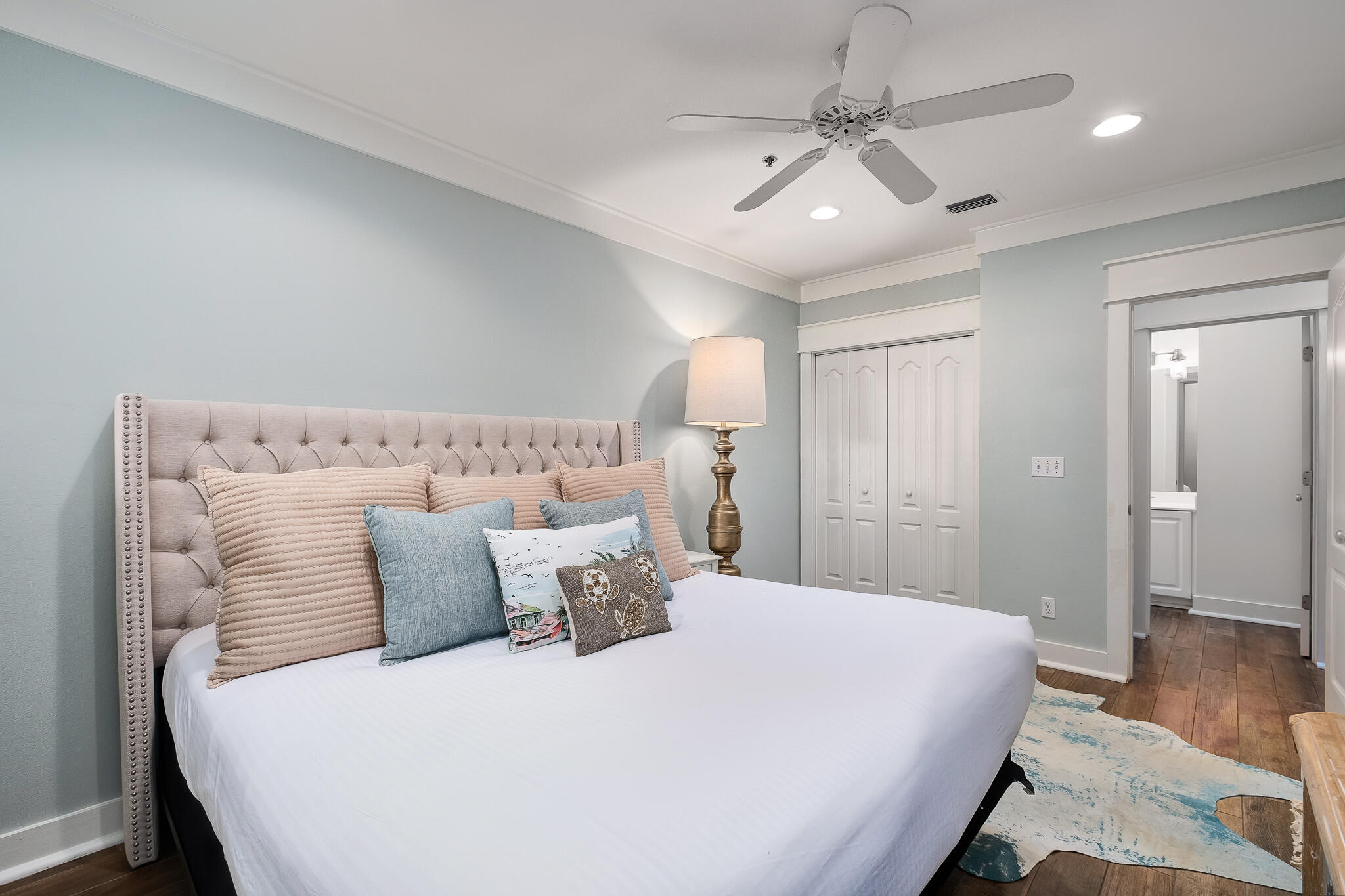 10140 East County Highway 30A, Unit A102 Inlet Beach, FL 32461 - Photo 19 of 37 a bedroom with a large bed and a chandelier