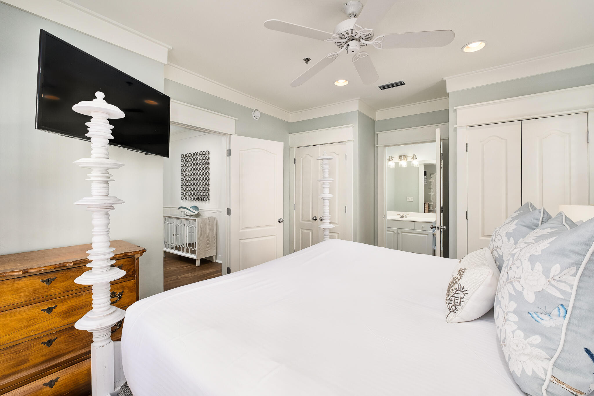 10140 East County Highway 30A, Unit A102 Inlet Beach, FL 32461 - Photo 21 of 37 a bedroom with a bed and a chandelier