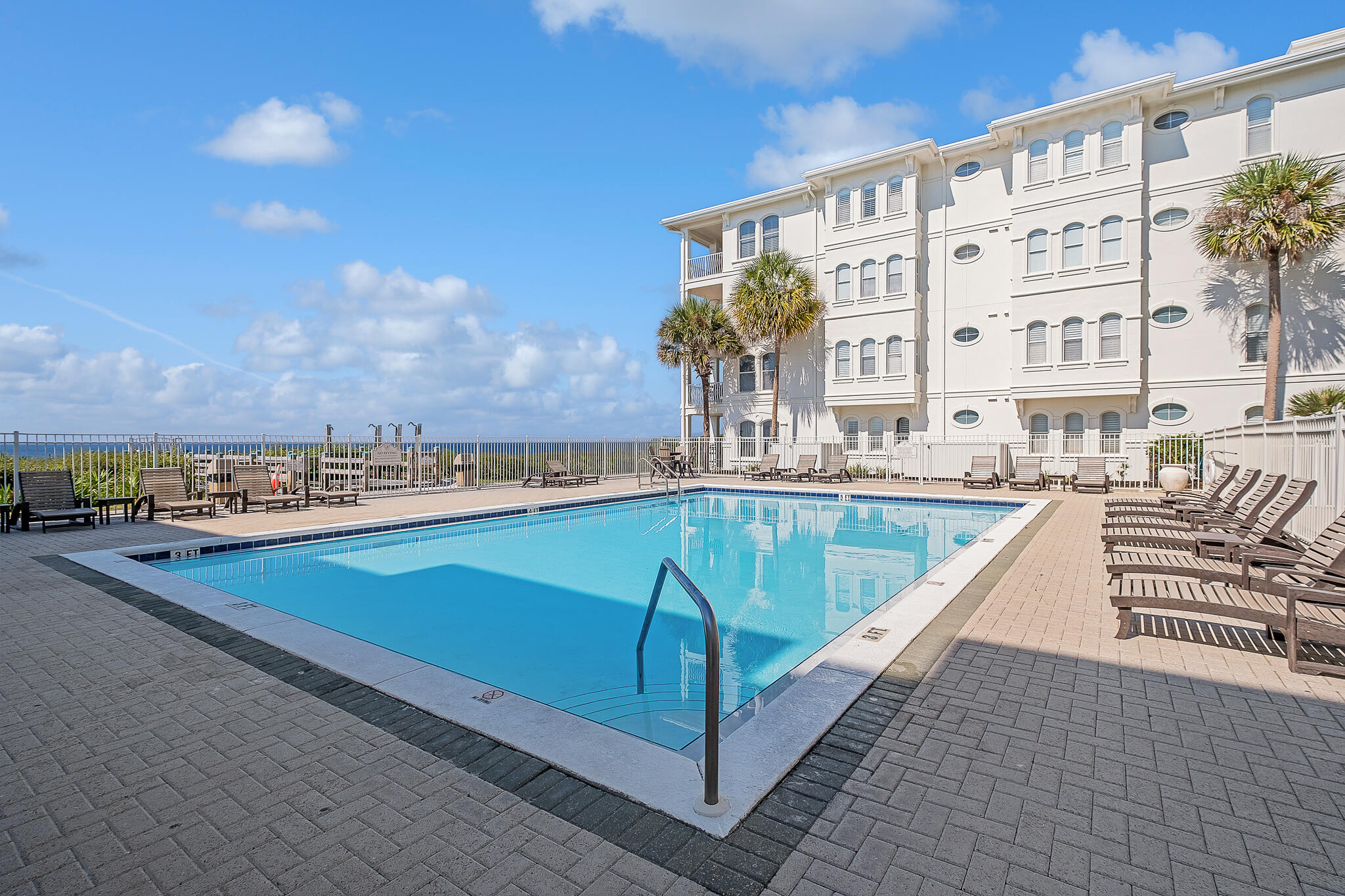 10140 East County Highway 30A, Unit A102 Inlet Beach, FL 32461 - Photo 27 of 37 a view of a swimming pool with a lounge chair