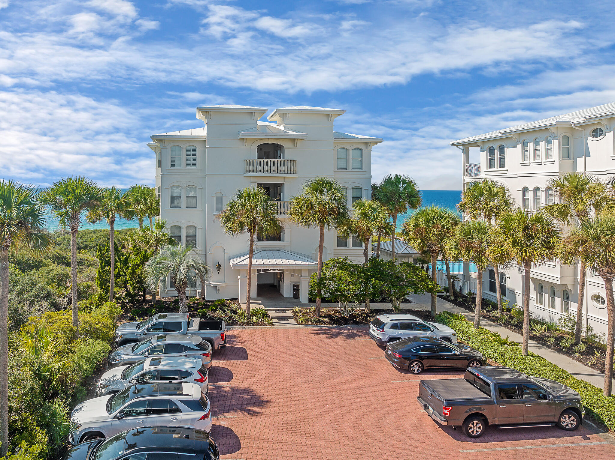 10140 East County Highway 30A, Unit A102 Inlet Beach, FL 32461 - Photo 32 of 37 a view of a patio with table and chairs and potted plants