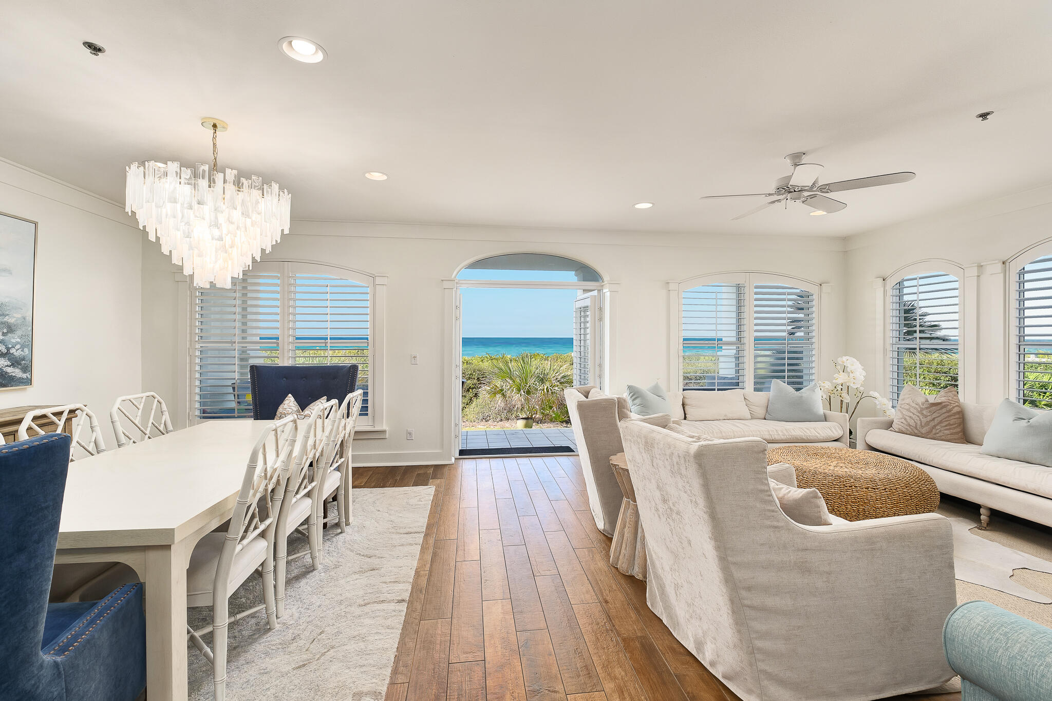 10140 East County Highway 30A, Unit A102 Inlet Beach, FL 32461 - Photo 4 of 37 a view of a dining room with furniture wooden floor and chandelier