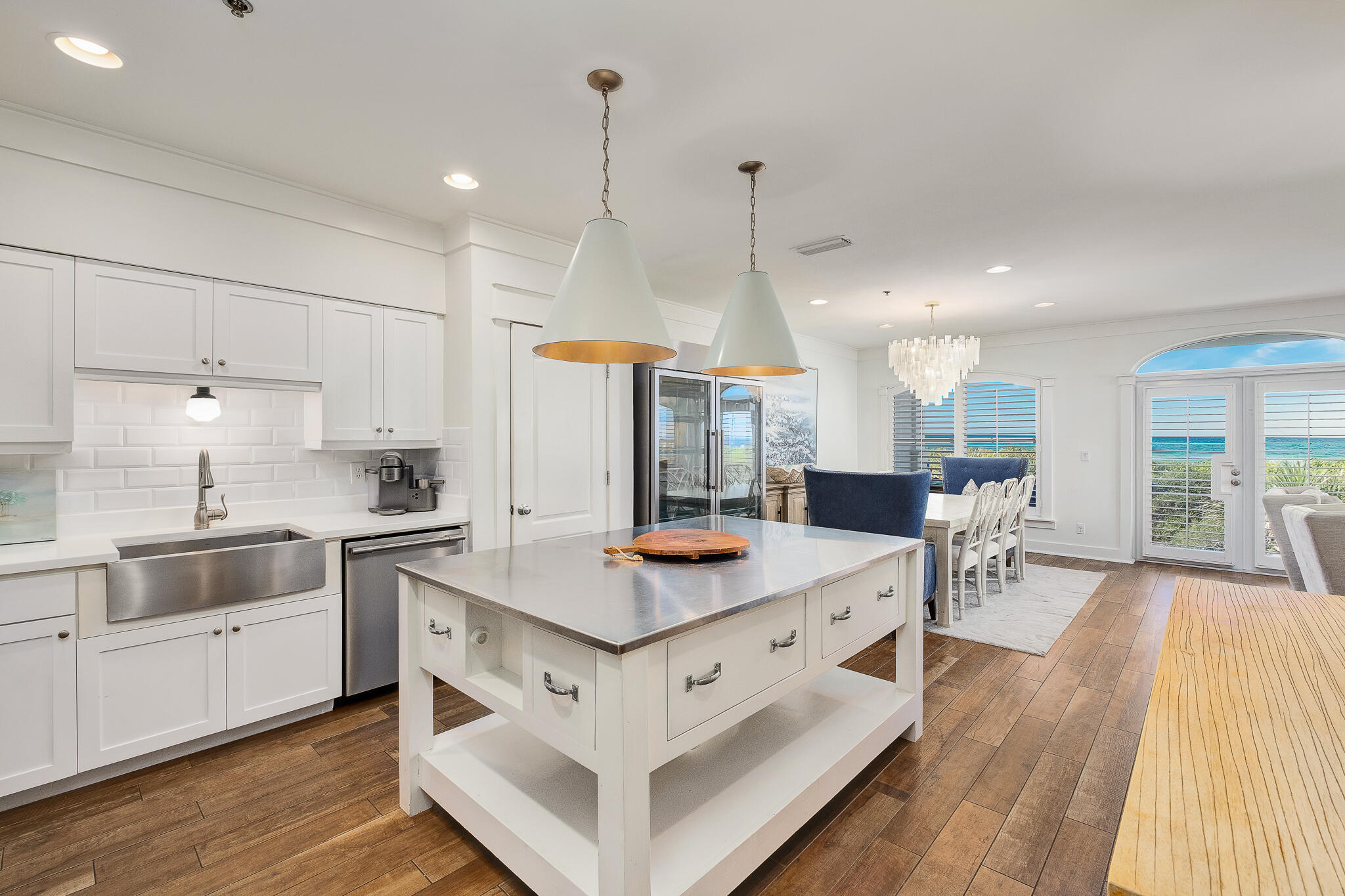10140 East County Highway 30A, Unit A102 Inlet Beach, FL 32461 - Photo 8 of 37 a kitchen with stainless steel appliances granite countertop a sink stove and wooden floor
