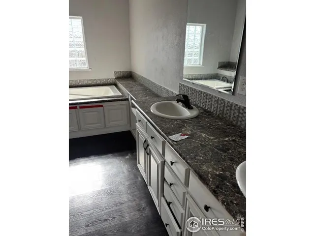 a kitchen with a sink and a stove