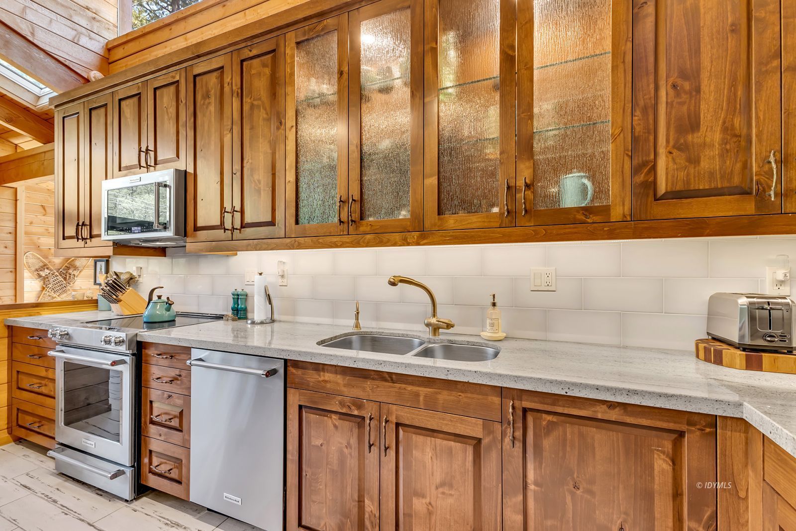 24924 Fern Valley Road Idyllwild, CA 92549 - Photo 40 of 72 a kitchen with stainless steel appliances granite countertop a sink a stove and cabinets