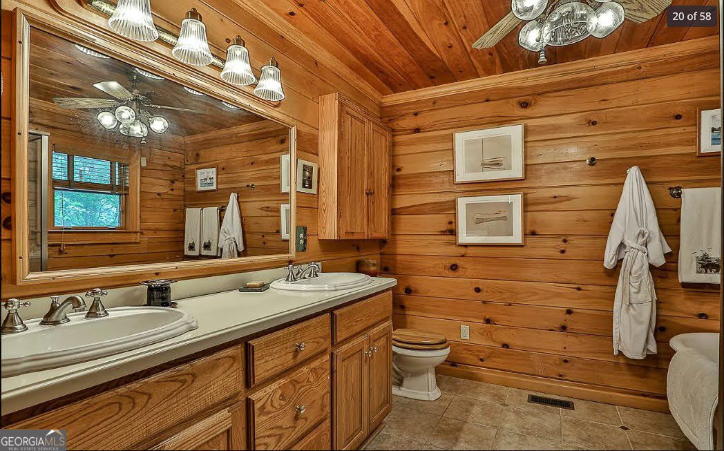 1427 Cherry Lake Drive Blue Ridge, GA 30513 - Photo 25 of 89 a bathroom with a sink and a mirror