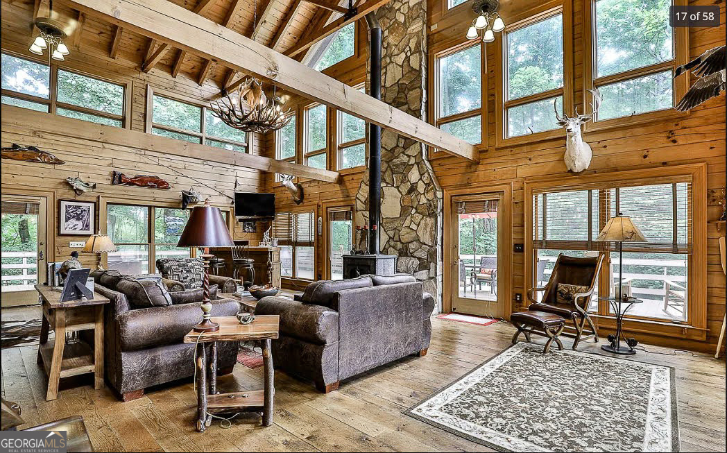1427 Cherry Lake Drive Blue Ridge, GA 30513 - Photo 3 of 89 a living room with furniture and a floor to ceiling window
