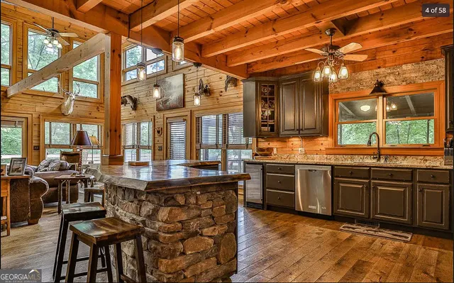 a living room with furniture and a floor to ceiling window