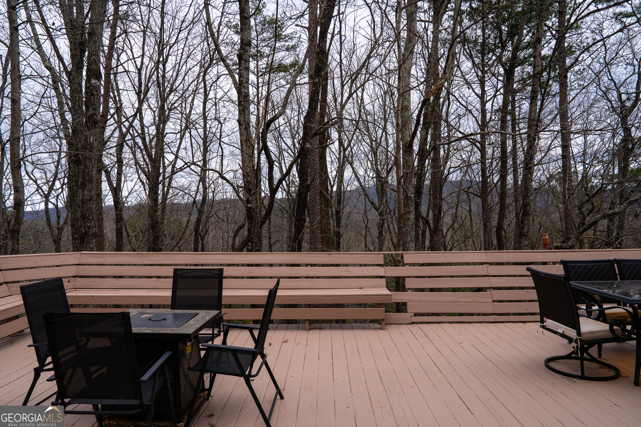 1427 Cherry Lake Drive Blue Ridge, GA 30513 - Photo 80 of 89 a view of patio with table and chairs and couches with wooden floor and fence