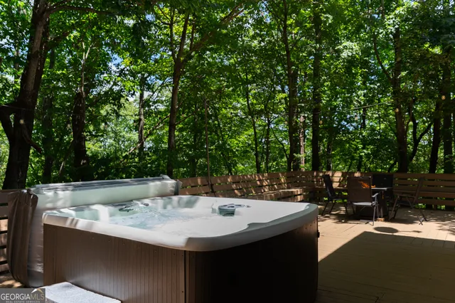 a view of a chairs and table in the balcony