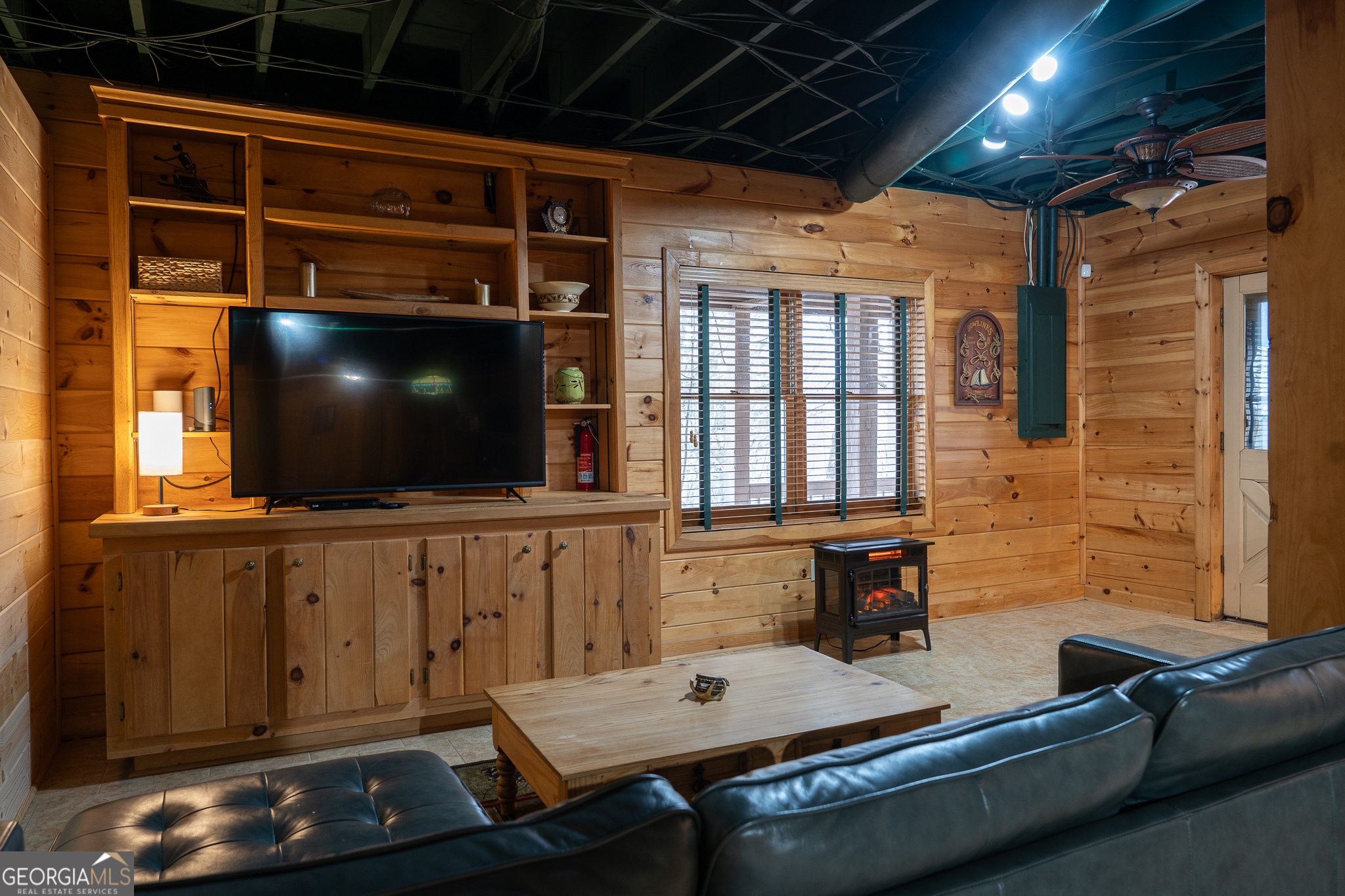 1427 Cherry Lake Drive Blue Ridge, GA 30513 - Photo 88 of 89 a living room with furniture and a flat screen tv