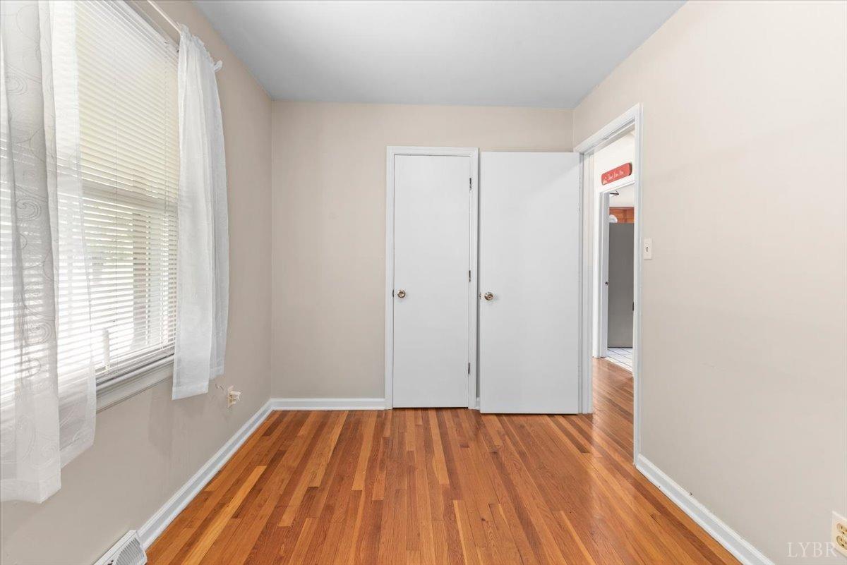 1752 Purdum Mill Road Appomattox, VA 24522 - Photo 17 of 38 a view of a room with wooden floor and windows