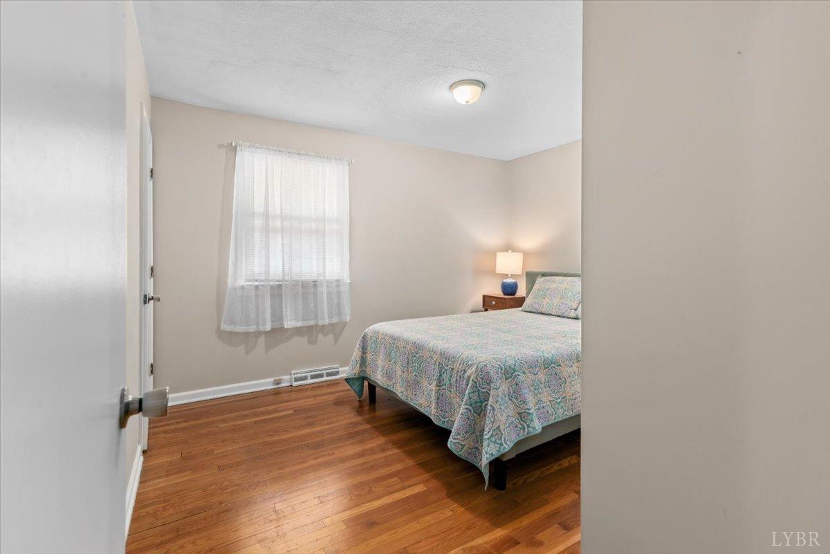 1752 Purdum Mill Road Appomattox, VA 24522 - Photo 19 of 38 a bedroom with a bed and a window