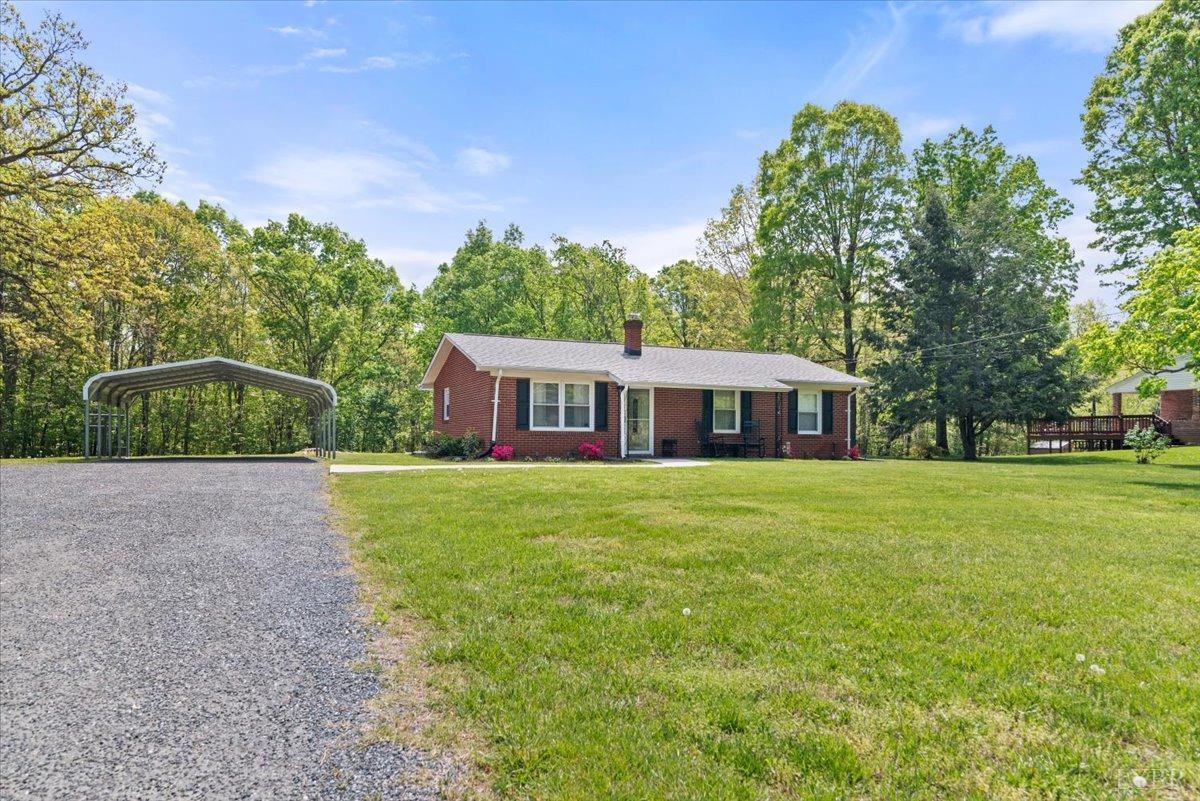 1752 Purdum Mill Road Appomattox, VA 24522 - Photo 2 of 38 a front view of a house with a garden