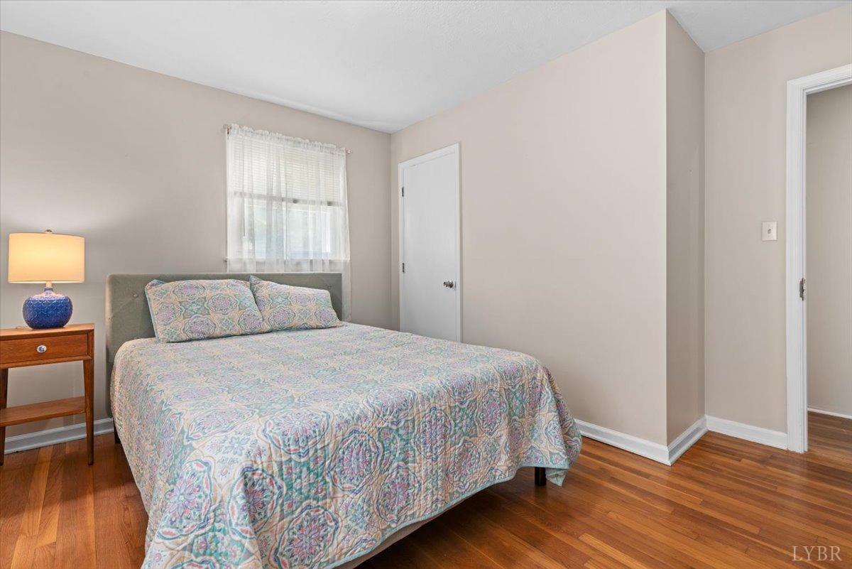 1752 Purdum Mill Road Appomattox, VA 24522 - Photo 21 of 38 a bedroom with a bed and wooden floor