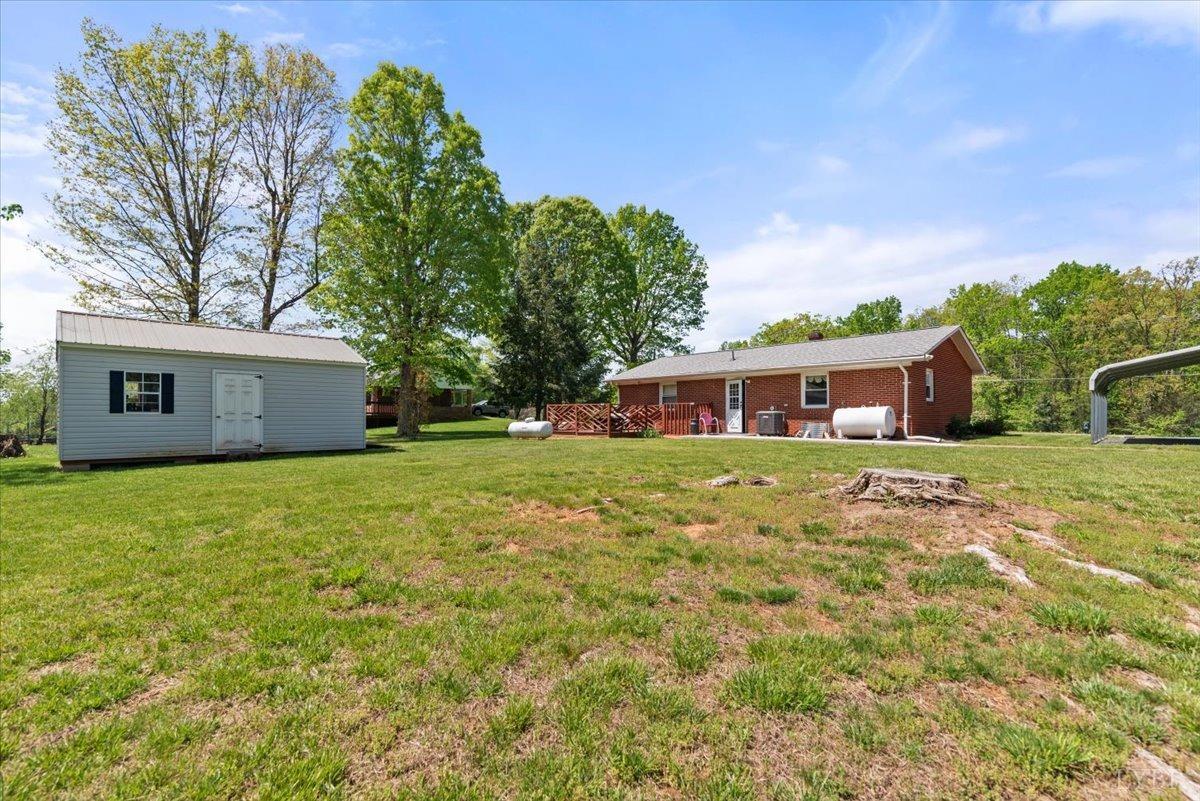 1752 Purdum Mill Road Appomattox, VA 24522 - Photo 30 of 38 a front view of house with yard and trees in the background