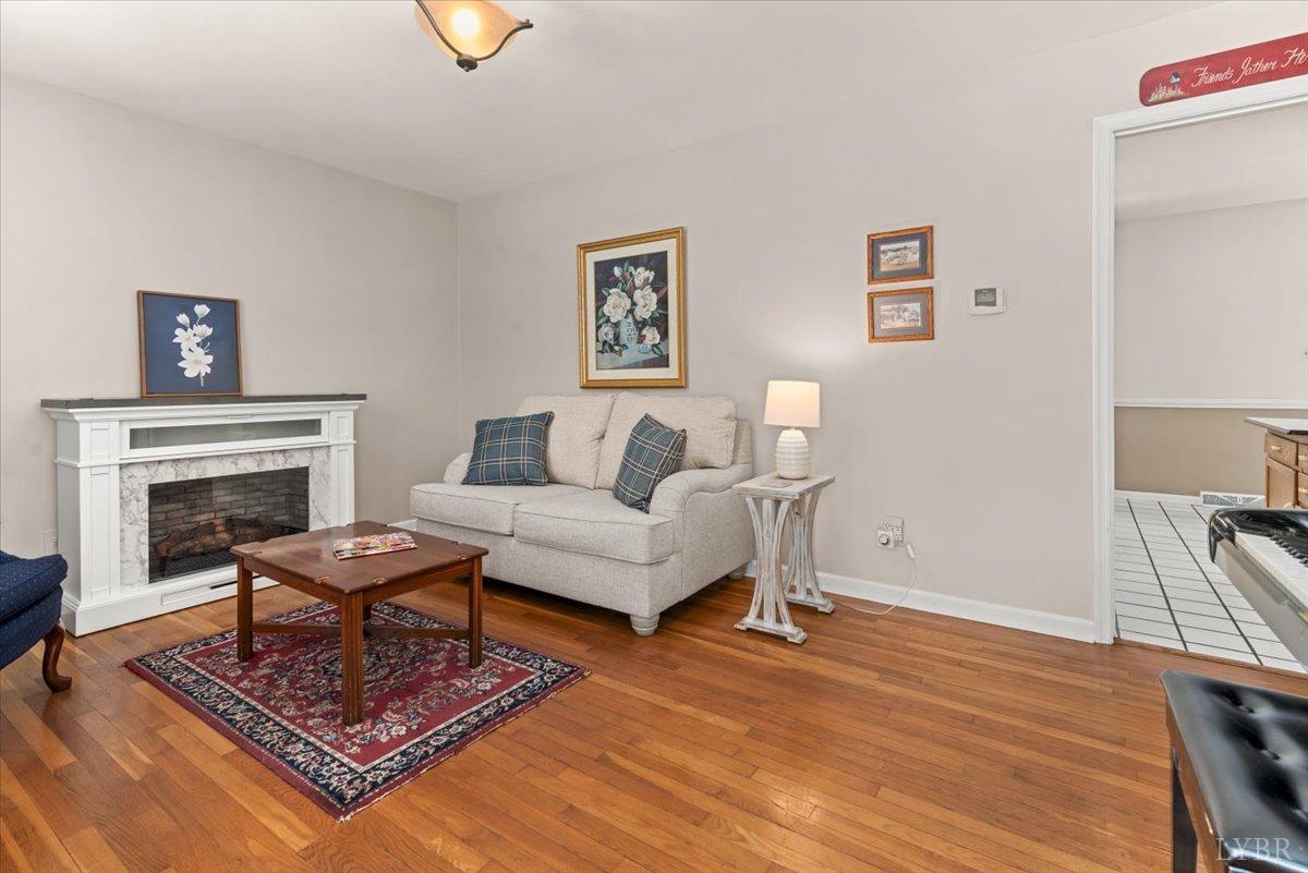 1752 Purdum Mill Road Appomattox, VA 24522 - Photo 5 of 38 a living room with furniture and a fireplace