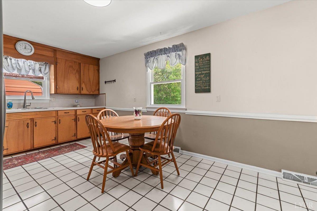 1752 Purdum Mill Road Appomattox, VA 24522 - Photo 9 of 38 a view of a dining room with furniture and window