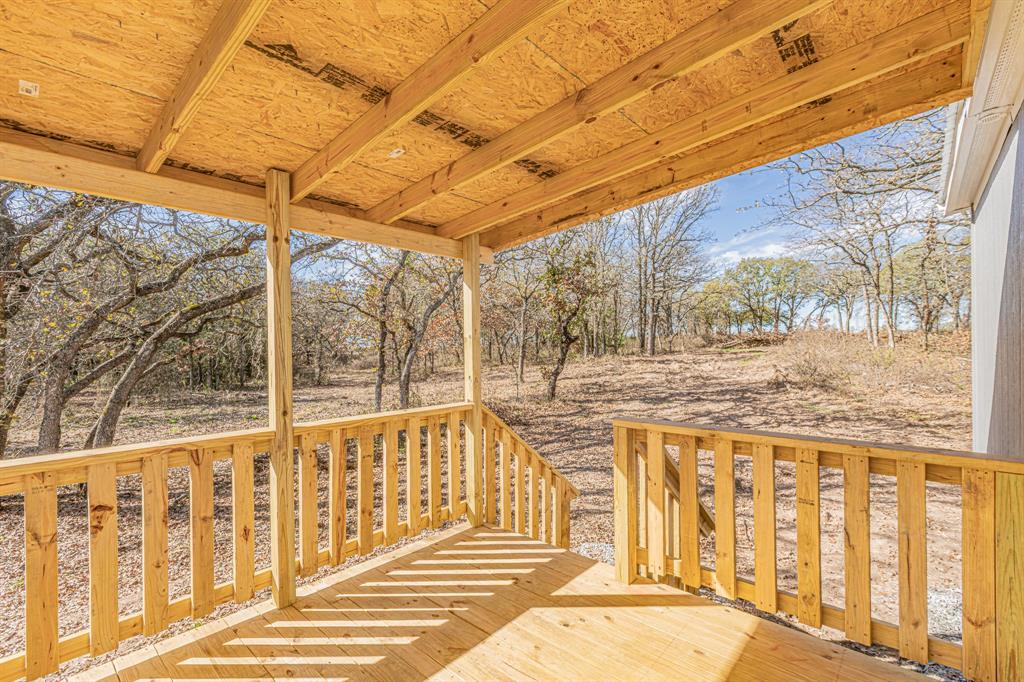 300 Huddleston Road Sunset, TX 76270 - Photo 36 of 38 a view of a porch