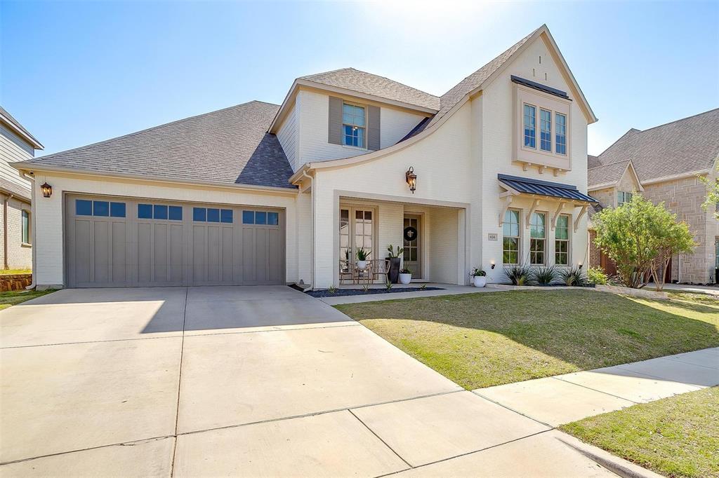 a view of a white house with a swimming pool