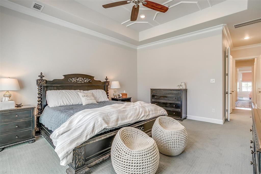 604 Rockfall Way Aledo, TX 76008 - Photo 14 of 33 a bedroom with a bed and a chandelier