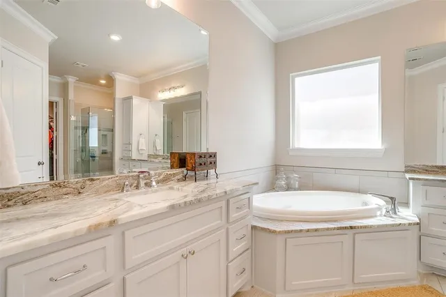 a bathroom with a sink double vanity and a mirror