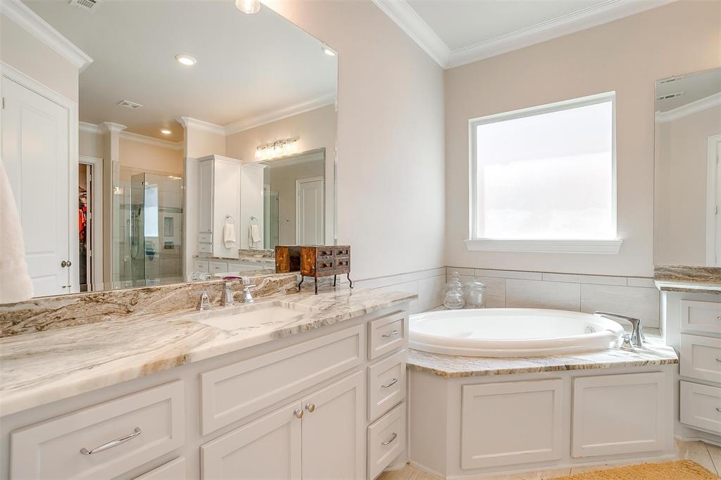 604 Rockfall Way Aledo, TX 76008 - Photo 16 of 33 a bathroom with a sink double vanity and a mirror