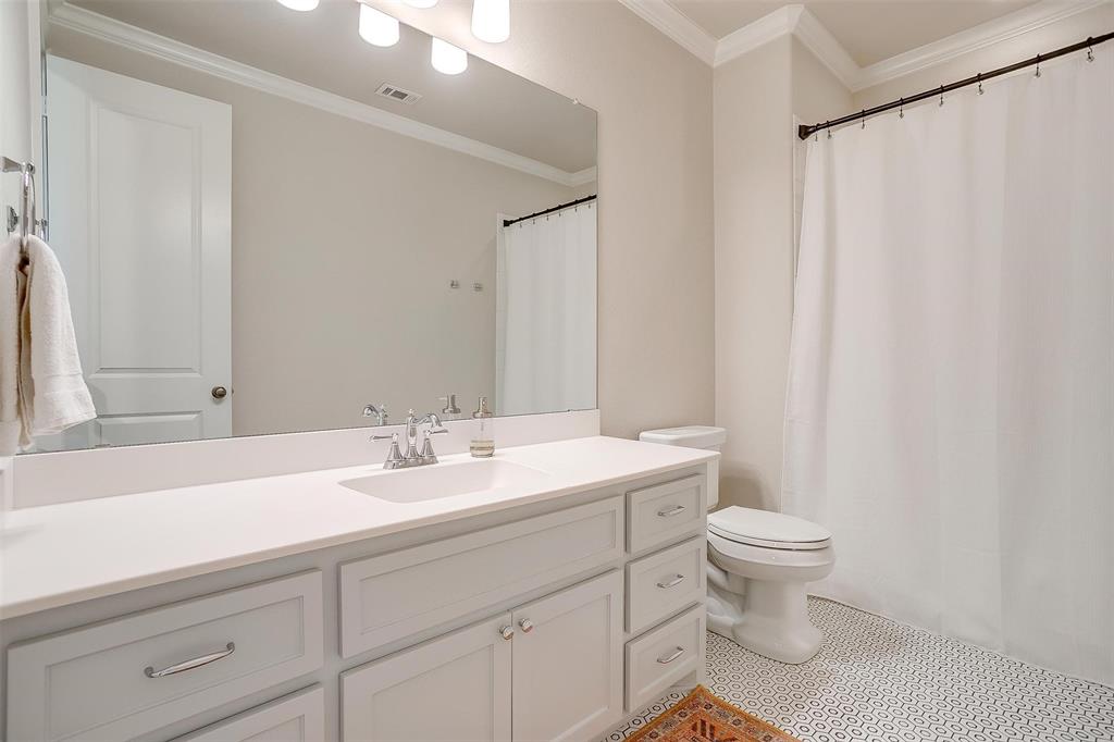 604 Rockfall Way Aledo, TX 76008 - Photo 22 of 33 a bathroom with a sink a toilet and a mirror