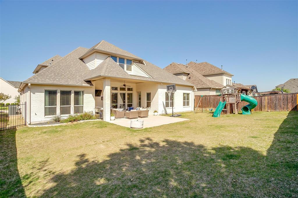 604 Rockfall Way Aledo, TX 76008 - Photo 29 of 33 a front view of a house with a garden and porch