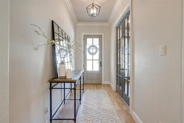a dining room with furniture and a window