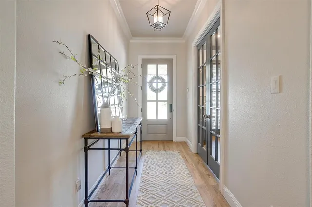 a dining room with furniture and a window