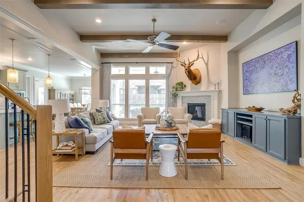 a living room with fireplace furniture and a fireplace