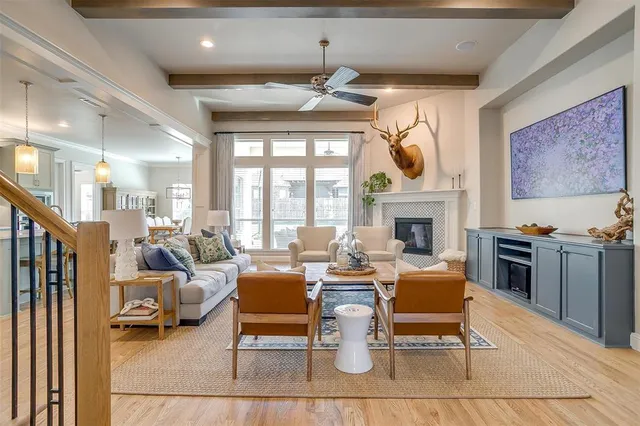 a living room with fireplace furniture and a fireplace