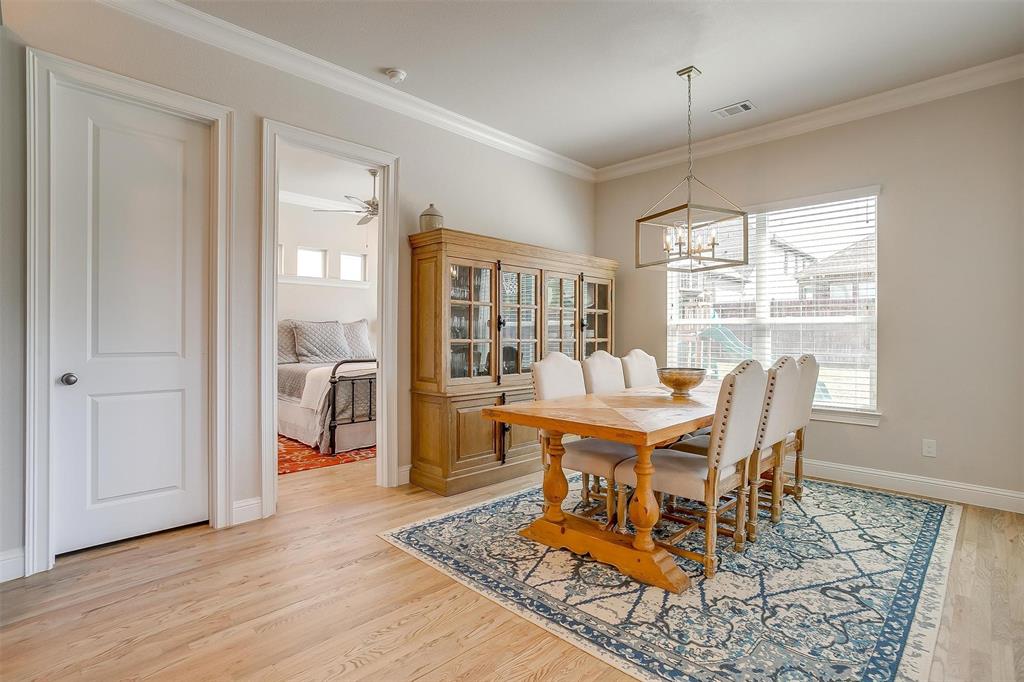 604 Rockfall Way Aledo, TX 76008 - Photo 10 of 33 a dining room with wooden floor and a rug