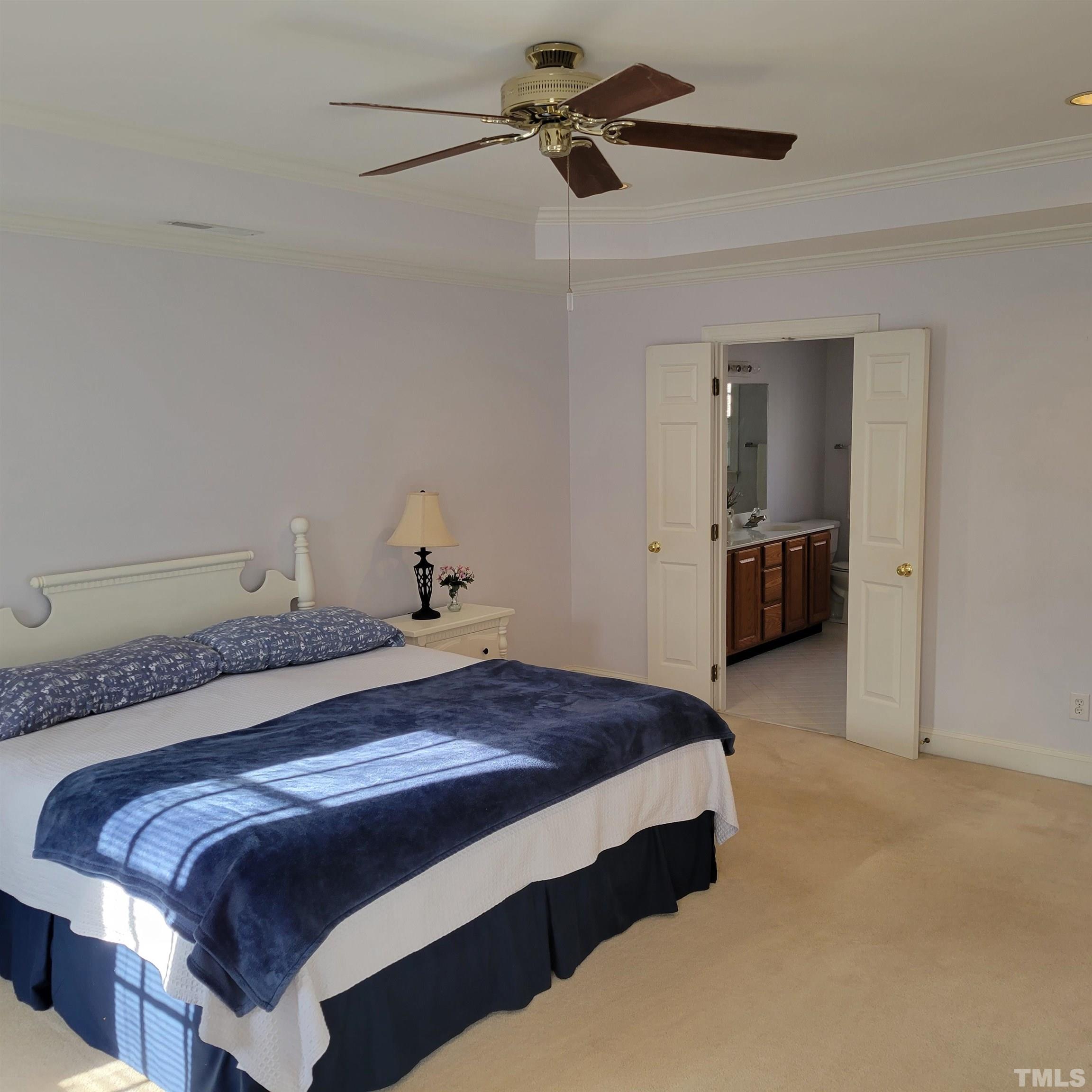 11817 Pembridge Lane Raleigh, NC 27613 - Photo 14 of 40 a bedroom with a bed and dresser