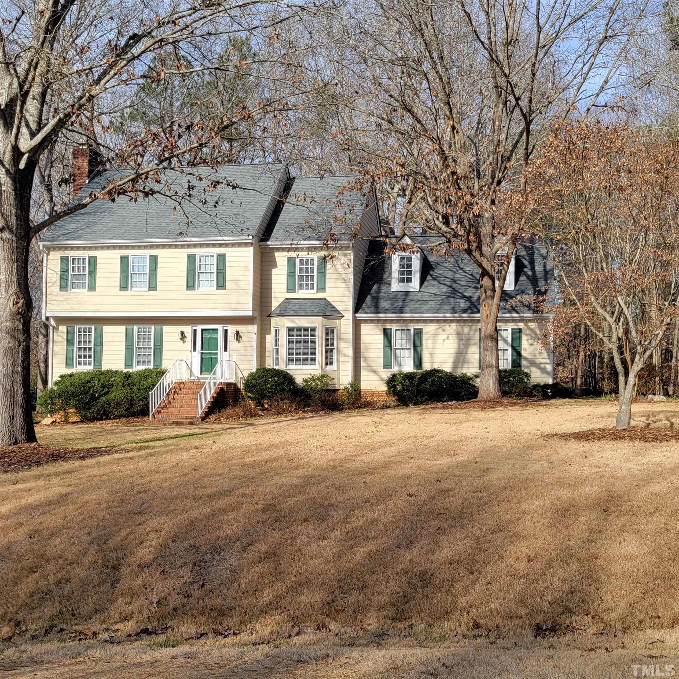 11817 Pembridge Lane Raleigh, NC 27613 - Photo 2 of 40 a front view of a house with a yard
