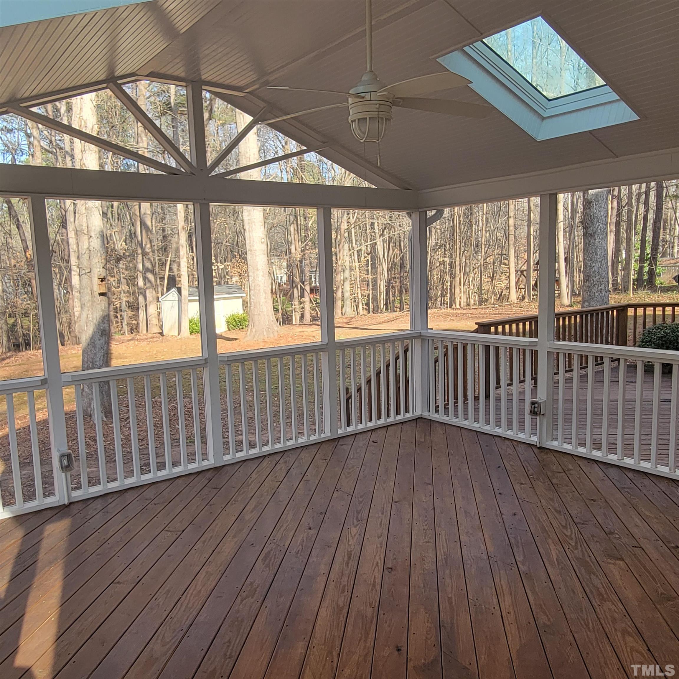 11817 Pembridge Lane Raleigh, NC 27613 - Photo 29 of 40 an empty room with wooden floor and windows