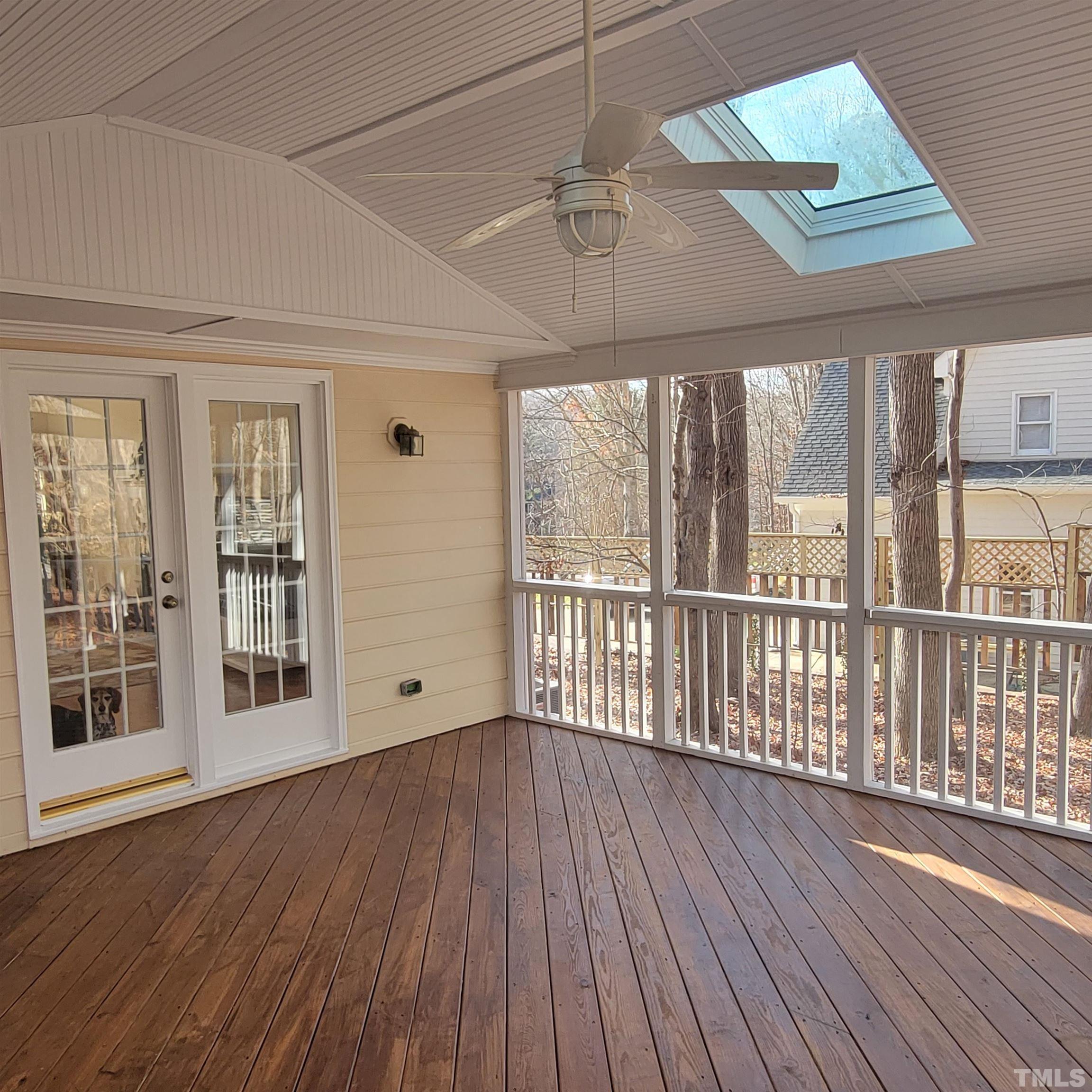 11817 Pembridge Lane Raleigh, NC 27613 - Photo 32 of 40 a view of an empty room with wooden floor and a window