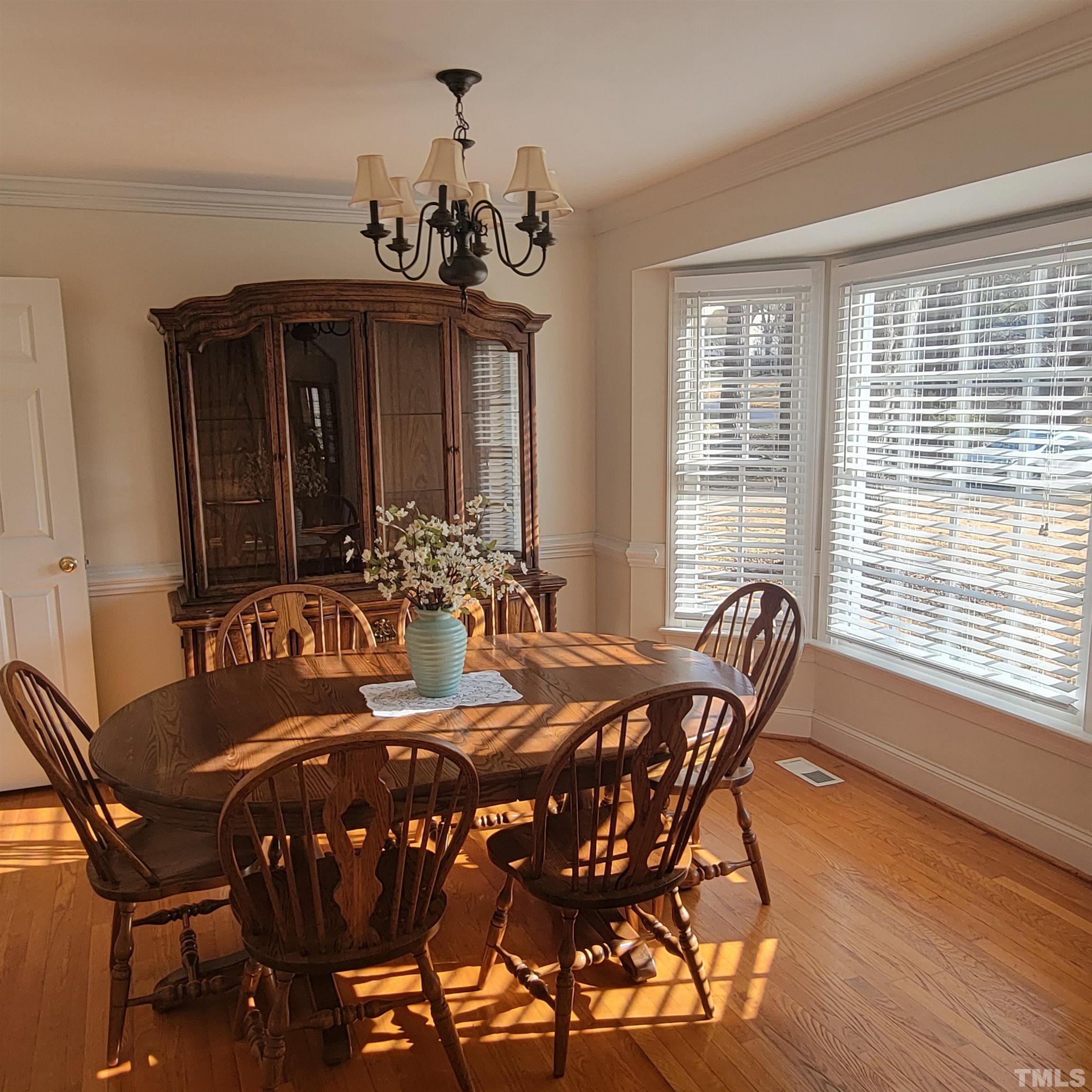 11817 Pembridge Lane Raleigh, NC 27613 - Photo 5 of 40 a view of a dining room with furniture and window